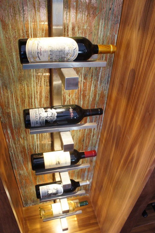 Here you can see the texture that the copper patina panels add.  The vertical stainless rack is backlit so that the wine labels are highlighted.