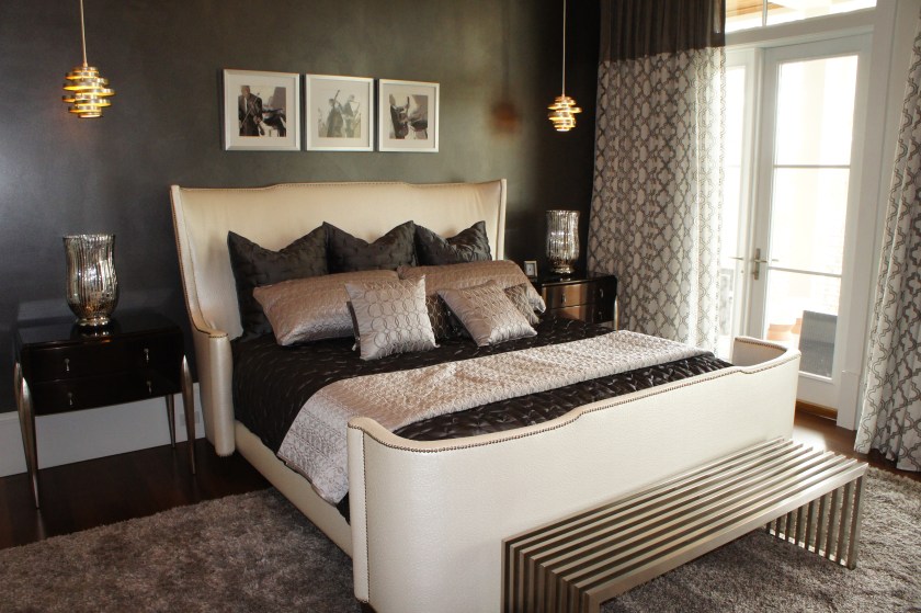 The ostrich leather king bed contrasts nicely with the smoldering charcoal gray wall finish.  
