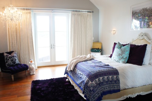This is one of the daughters' rooms on the third floor.  This one's taste was that of high glamour, but grounded enough for the beach!  The bed from Oly emphasized just this, with its intricately carved frame and raffia upholstery. The crystal chandelier in the corner created some drama.