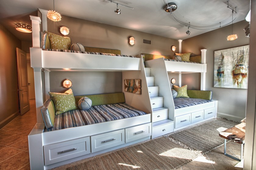 Custom built-in bunk beds: We utilized the length and unique shape of the room by building a double twin-over-full bunk wall. 