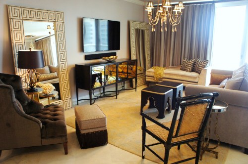 Sometimes you don't realize how small a space really is until you start putting furniture in.  One way to counteract this is to use large leaning mirrors that reflect the room and make it appear larger.  These ostrich leather, studded greek key mirrors reflect the ocean and light, while adding some graphic pizazz! 