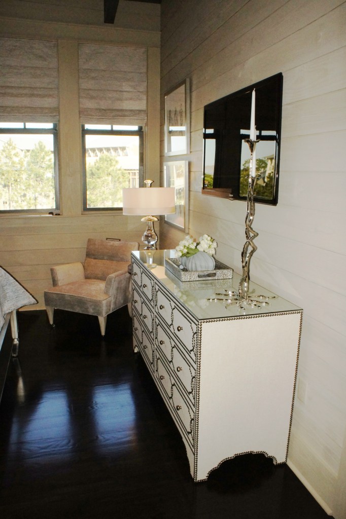 This linen-covered dresser kept the feel of the room light, and helps to counteract the dark floors. Since taking these photos, we have added a gorgeous silk area rug that reflects the light even more.