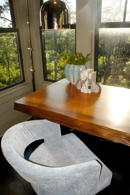 This desk used to be a counter-height dining table on the second floor.  I had the legs shortened to desk height, and then silver leafed and sealed to protect against rusting.    Placed against these windows, this desk provided an ideal area to work!