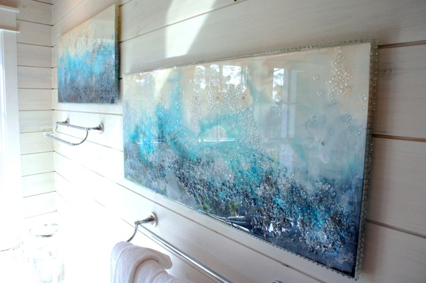 I commissioned local artist, Mary Hong, to design us some beautiful eye-popping artwork in this room. These are acrylic panels, to which she added glass and dye, then a finishing resin.