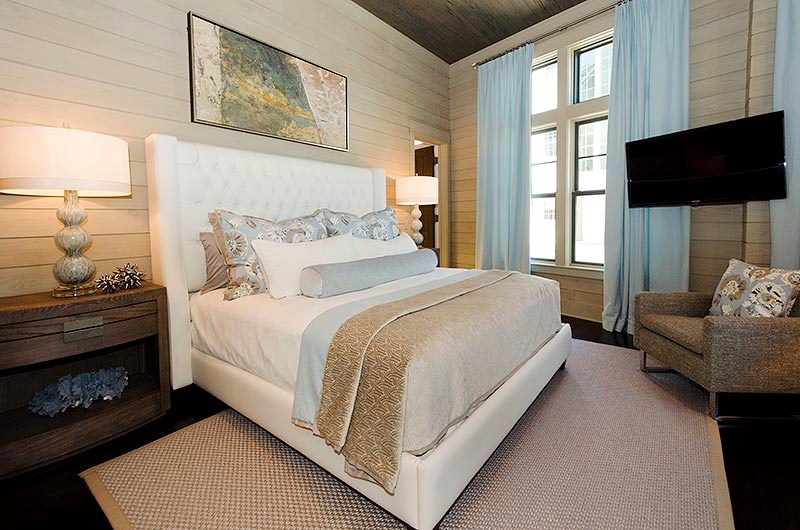 Guest Bedroom, First Floor: I furnished this room with a tall custom bed in off-white leather, and long ice blue linen drapes.
