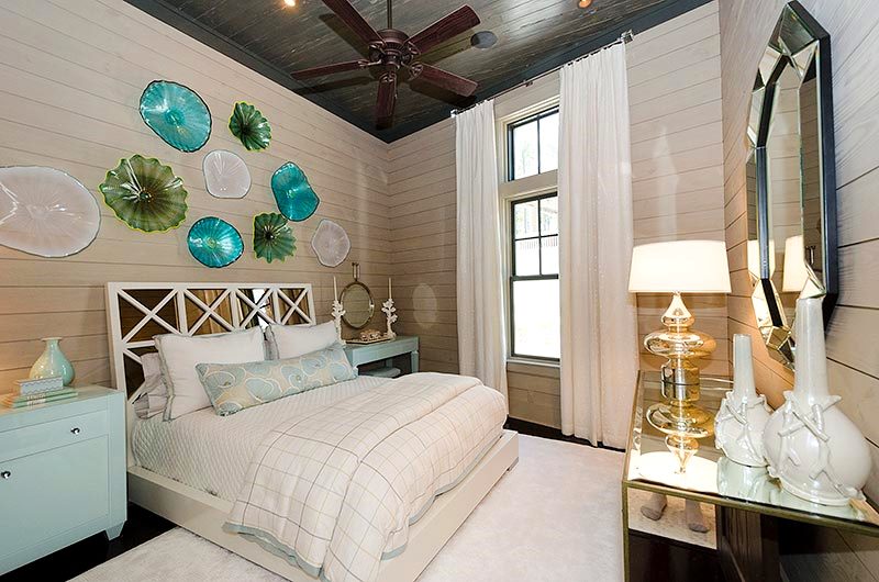 Second Guest Bedroom: I lightened this room with a white mirrored bed, a cream silk area rug, some cream drapes, green glass nightstands and some reflective glass and mirrors!