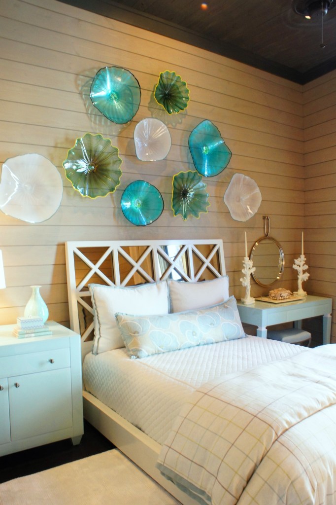 I designed this custom art glass installation above the bed to add color to the room, and take advantage of the high ceilings.