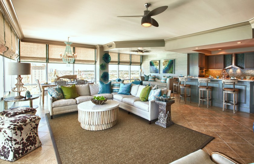 Sectionals are not always the blunt, stagnant, non-versatile giants that some designers make them out to be! Although not all rooms can handle one, there are ways of making sure they will work in your space. You can make sure you choose the proper scale for your room, choose a shallow depth if needed, use lighter fabrics and brighten things up with multiple toss pillows! Always make sure they give you brackets to attach the segments, and more importantly, that the pieces will fit inside your elevator/doorways! In our case, we chose a lower back that allows an uninterrupted panoramic view of the beach, as well as an open communication to the other spaces in the room.