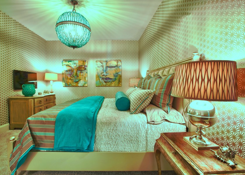 We had some fun with this room! This off-white geometric wallpaper served as an off-white patterned backdrop to some bright splashes of turquoise.