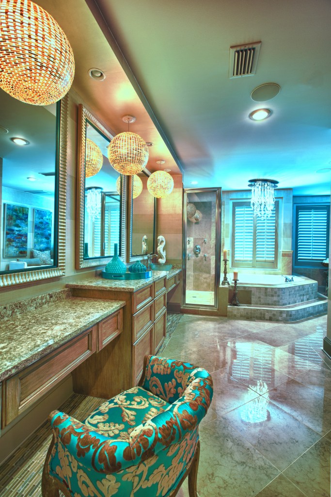 The Master Bathroom was given a makeover, with new cabinets and countertops, a faux finish wide stripe gracsscloth texture on the walls, and some eye-catching new lighting.