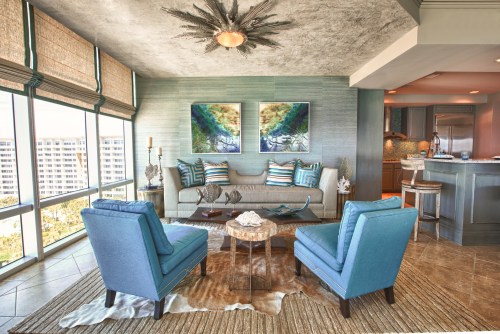 Inviting layers of texture help to define this space as the "Lounge".  Grasscloth and linen bring a natural element, while a plush area rug, layered with a cowhide add softness.  The dropped ceiling was texturized with a venetian plaster, which resembled shiny concrete. 