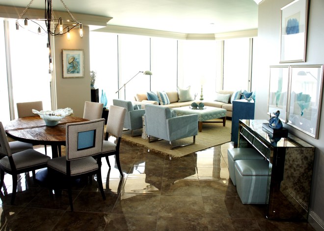 This Living / Dining / Kitchen area has an open layout, with unification of the different areas through color, texture and style.  