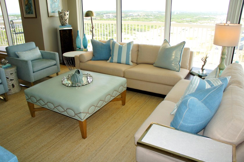 Having a sectional, with a low back and open corner allows the coastal seascape backdrop to shine!