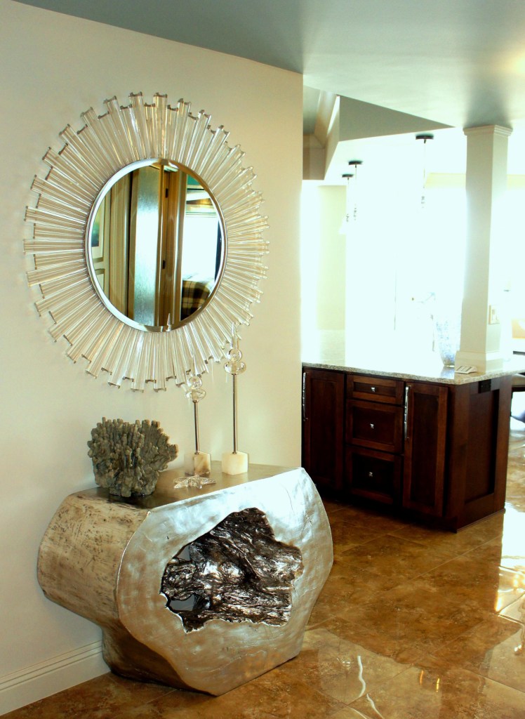 When you enter from the private elevator, this modern acrylic mirror and resin-cast silver leaf console table is what greets you!  I watned to make a statement in this small space!