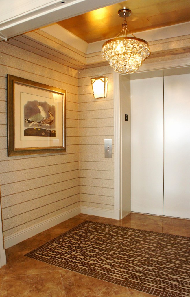 The tile inset visually balances the high interest we created on the ceiling.  