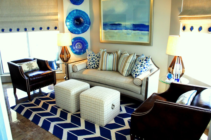 The Settee is by Caracole, the club chairs by Sam Moore, the upholstered stools by Vanguard Furniture, and the chevron rug by Surya.  