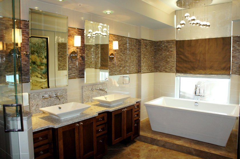 Here you can see how I designed the roman shade so that the wide accent band continued around, unobstructed, when the shades are down.  The raindrops chandelier brings in an organic, but modern element!