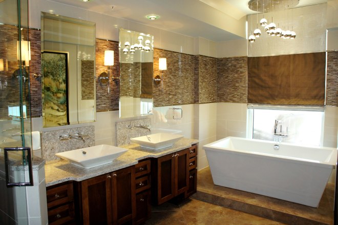 Here you can see how I designed the roman shade so that the wide accent band continued around, unobstructed, when the shades are down.  The raindrops chandelier brings in an organic, but modern element!