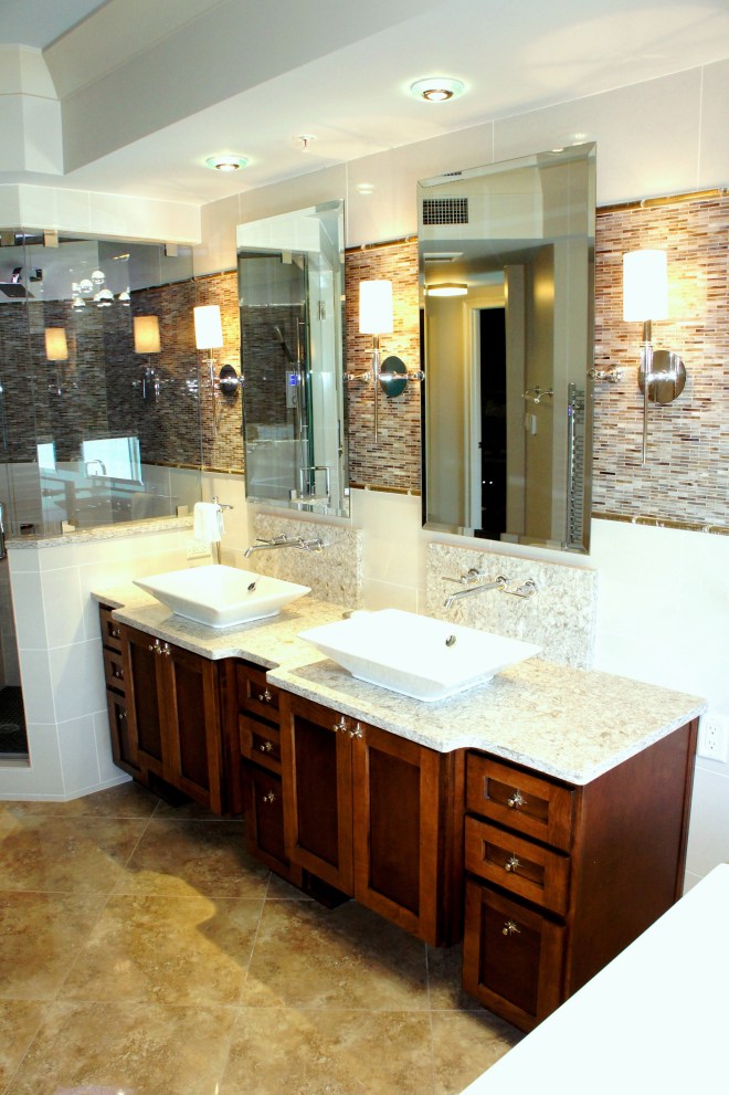 The horizontal band continues on through the steam shower.  The shower & vanity are separated only by a pony wall and glass.  I tried to do everything possible to make this bathroom feel more spacious!