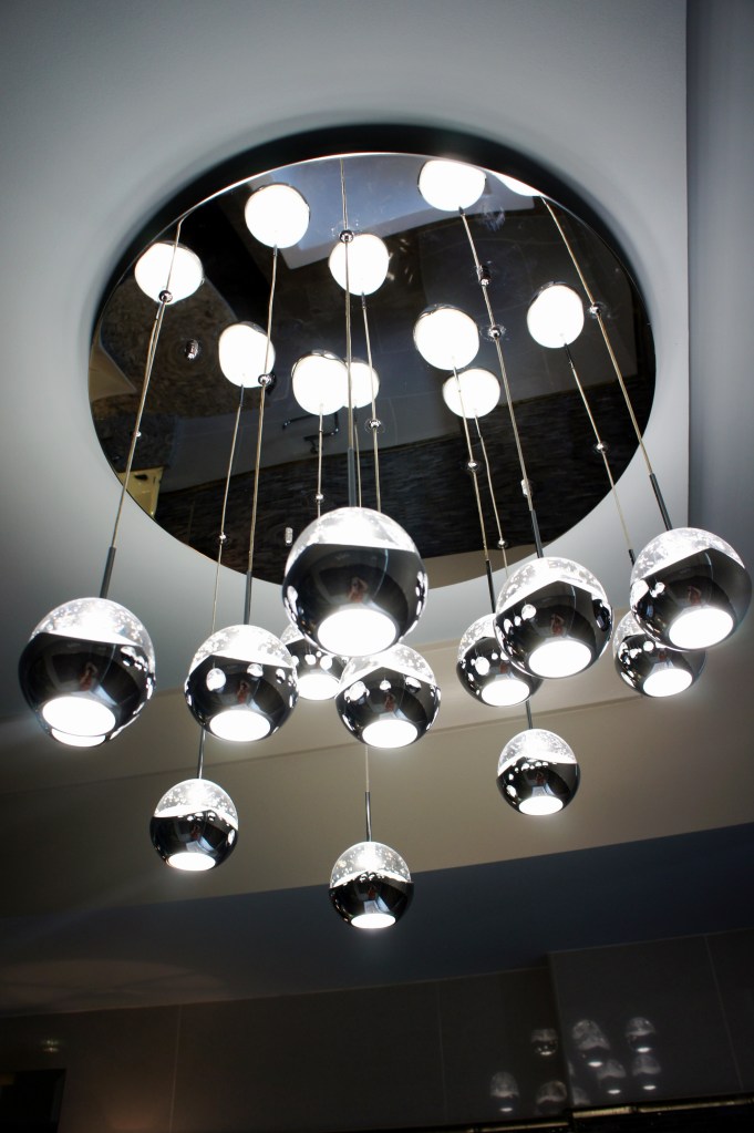 Here is the chandelier I used, which is the "Ice" 13-light pendant manufactured by Eurofase.