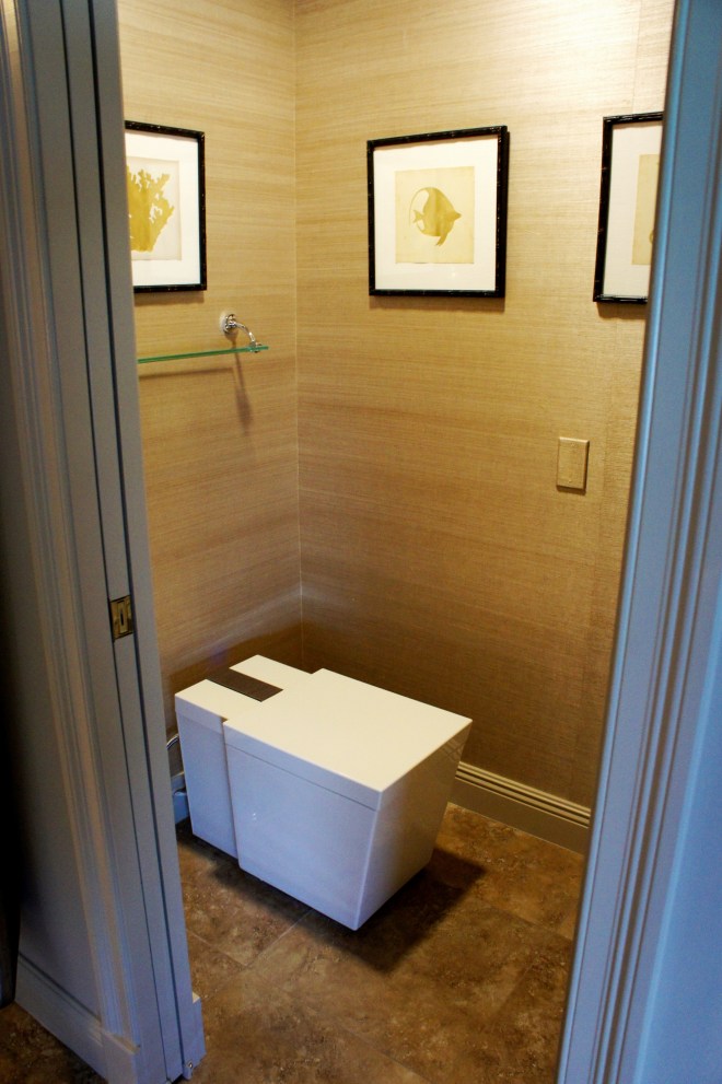 This might be the first toilet I've ever felt the need to show off!  This toilet senses you and opens/closes automatically, plays music, heats up, and all sorts of fancy stuff!  I got a kick out of how many workers it startled, as they were in there to hang pictures, etc.  I covered the walls in a warm gray and silver grass cloth.