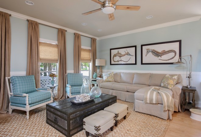 I felt that a sectional suited this space much more than a sofa and chair, which was crowding the staircase in the "before" photo.  The large chest I used as a cocktail table actually has hidden drawers in each end!  Nothing says relaxed like a great slipcovered sectional!  With the option to pull the cover off and wash it, it allows my clients to just relax and enjoy their space!