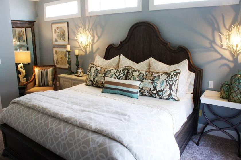 AFTER: I maximized the recessed nook to the left by placing a floor mirror, a comfortable chair and some pretty artwork.