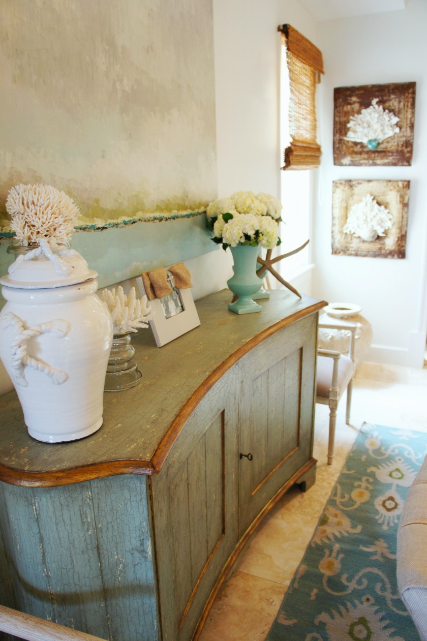 There's a whole lot of stuff that makes me happy in this photo! Original art, fresh hydrangeas, handmade pottery, natural coral, burlap and bling! (The picture frame has a rhinestone cross holding the burlap bow!)