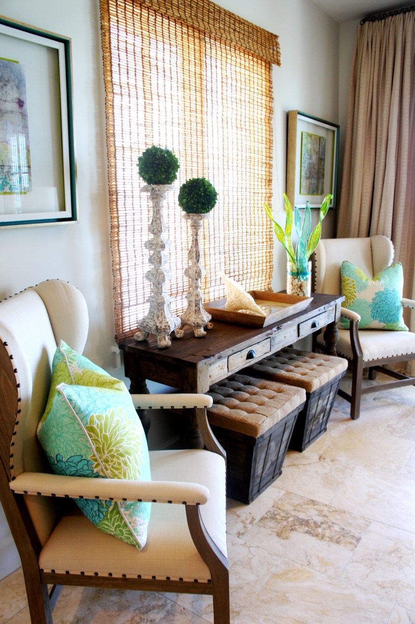 This console can be a desk, or accent table. I flanked the table with some linen and wood wing chairs, and threw in some color with some custom-made pillows, covered in a bright Manuel Canovas fabric.