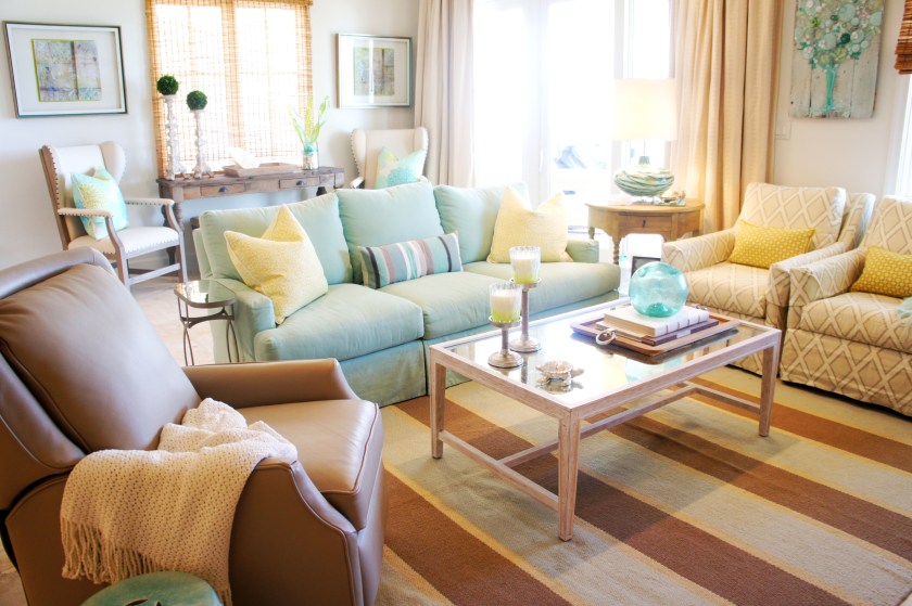 Here is our quaint little living area! Aqua, chartreuse and taupe blend together beautifully here, I think! The striped rug is from Design Avenue, the slipcovered sofa and chairs are from Tracery, and the cocktail table and recliner are from Lovelace Interiors!