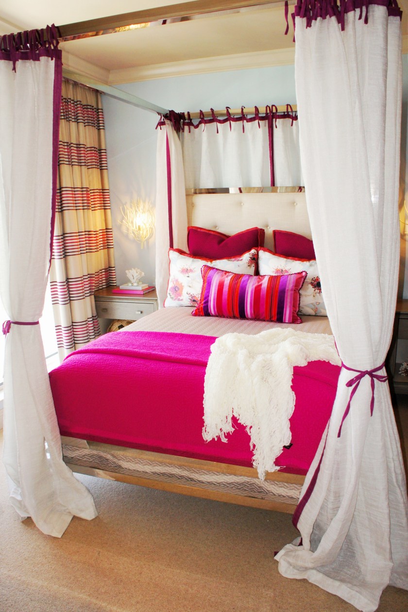 The chrome canopy bed is by Bernhardt Furniture.  I designed off-white canopy sheers, with magenta trim and ties, for a romantic feel!