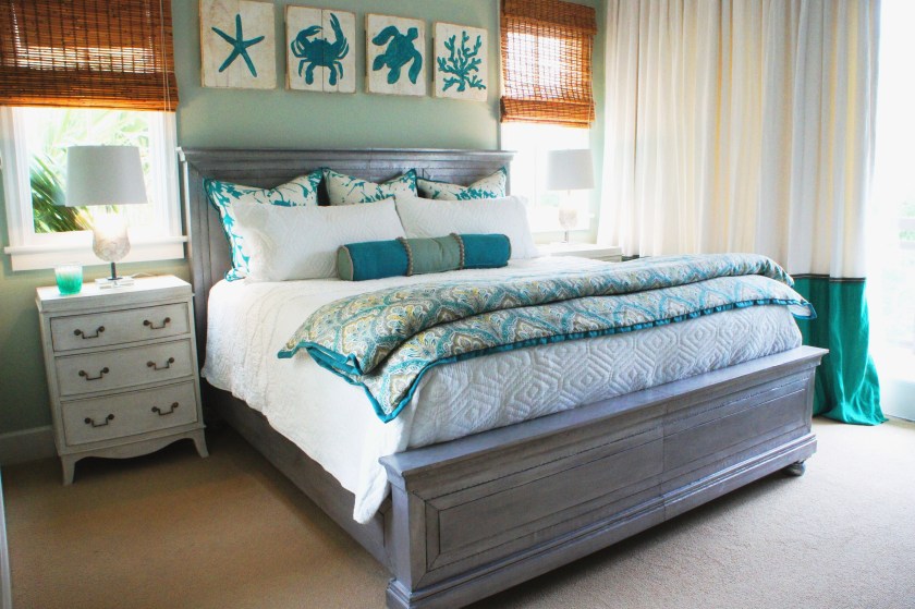 This, the Second Master Bedroom, was a favorite of mine! I love the mix of bright white with teal and aqua! I made some bright, fun euro pillows and a paisley fluffy foot blanket to match the drapes, then happened to find the perfect sealife art while shopping!