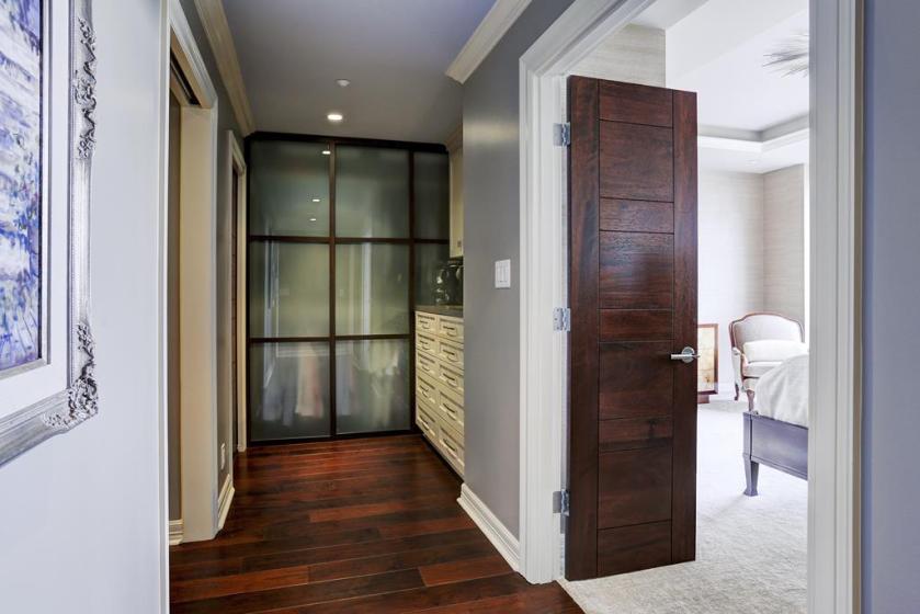 HIS closet AFTER: Look at these gorgeous frosted glass sliding doors! They dress the closet up, keep the room feeling open, and look totally handsome and rich!